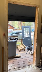 The rough opening of a house frame with the door frame removed