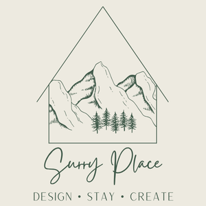 Logo of Surry Place featuring a house outline with mountains and trees, with the text 'Surry Place' and the tagline 'Design • Stay • Create' below.